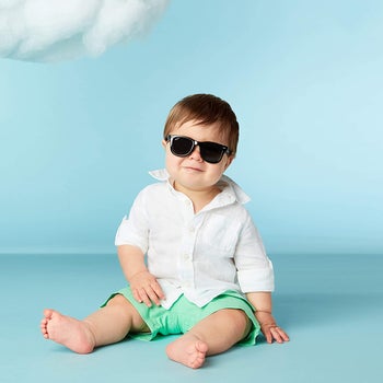 a toddler wearing sunglasses