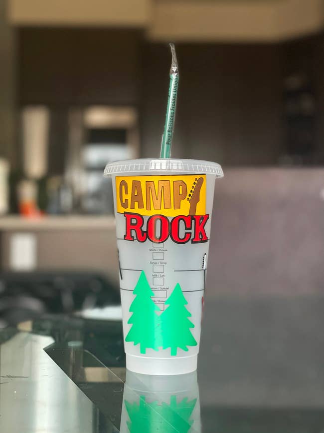 the camp rock inspired cup featuring the camp rock logo, a guitar, pine trees and more related designs