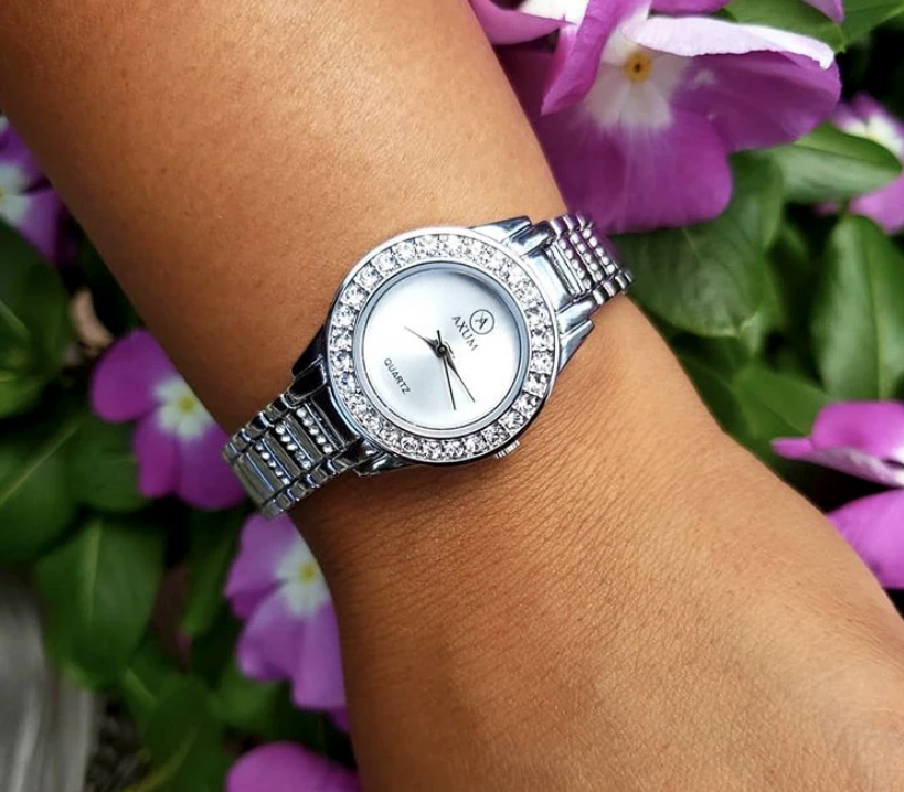 the silver watch on a wrist