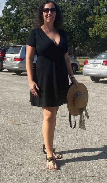 image of reviewer wearing the black dress