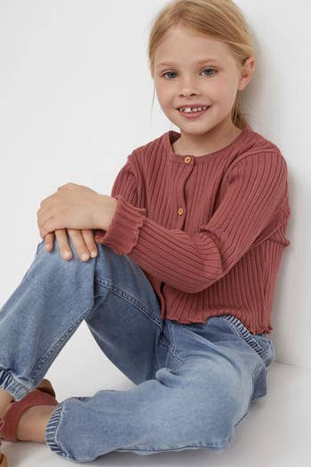 a child model in pull in denim