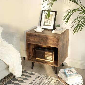 lifestyle photo, wooden nightstand next to bed