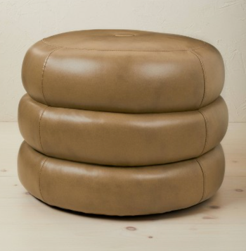 product image of the brown tire-shaped ottoman