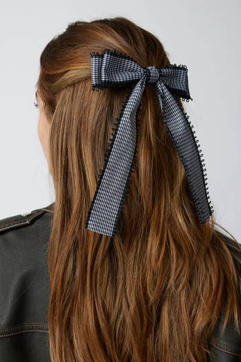 model in black gingham hair bow