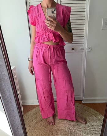 A reviewer wearing the set in pink