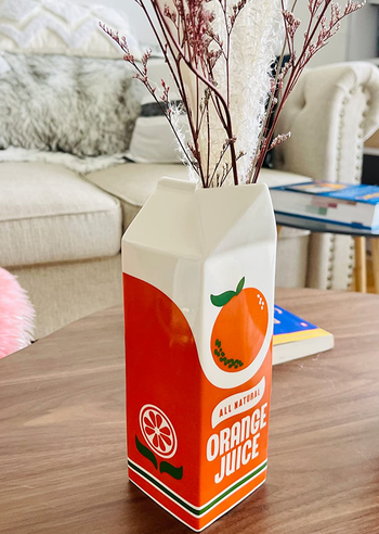 reviewer photo of the orange juice vase on a table