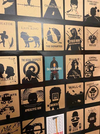 Close up image of poster showing detail of artwork and a few scratched-off squares in full color