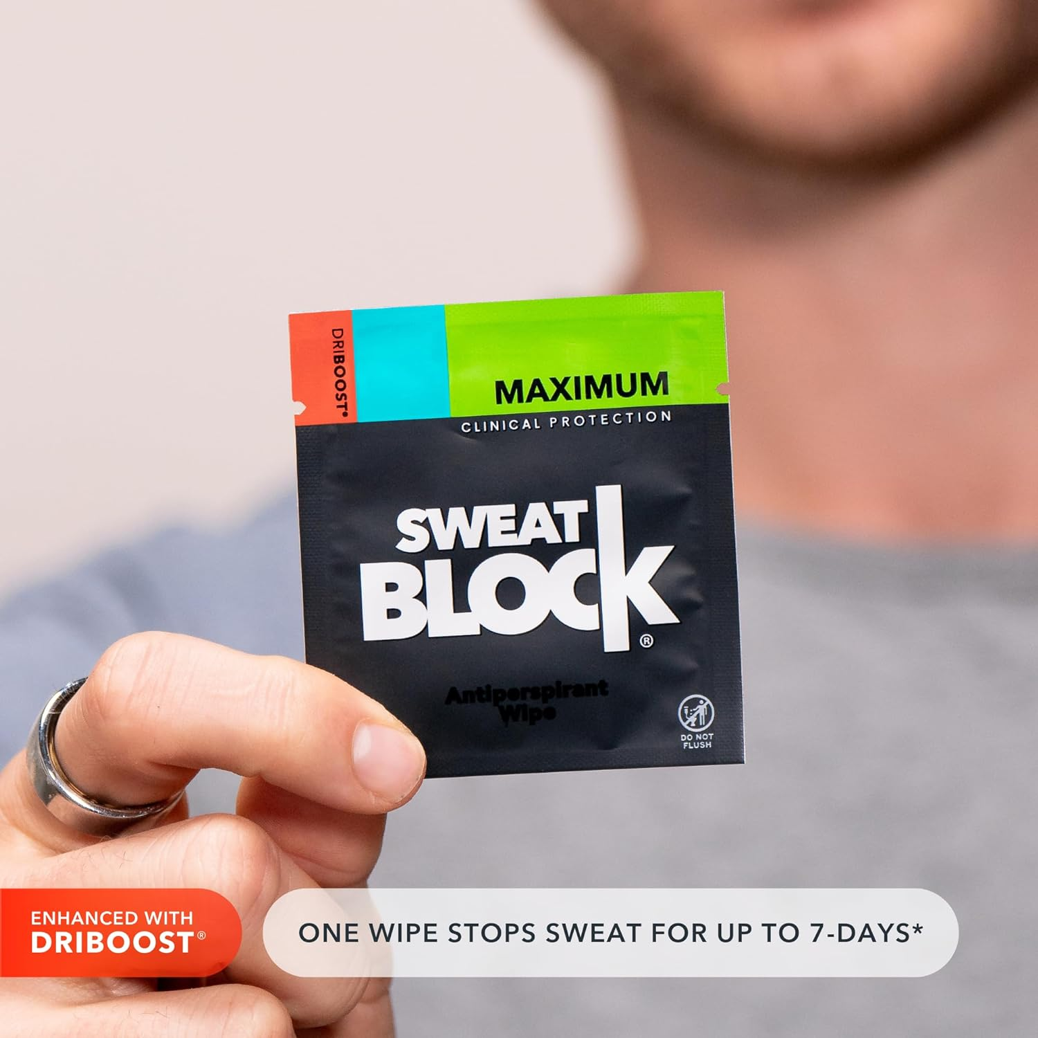 model holding a sweatblock wipe 