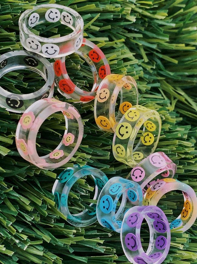 clear rings with different color smiley faces around them