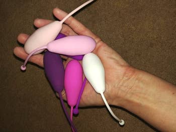 another reviewer holds the Kegel weights in their hand
