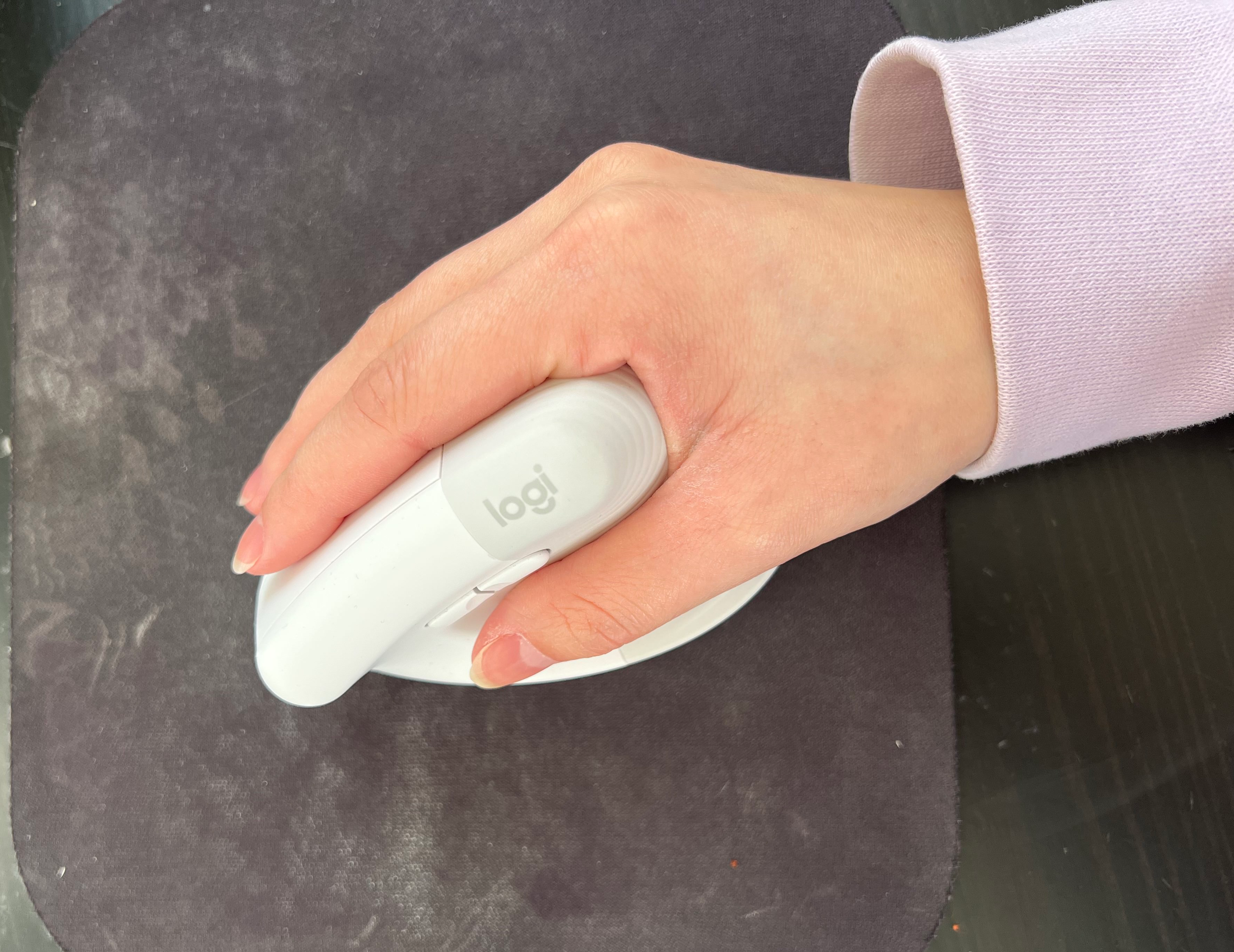 BuzzFeed editor holding white mouse