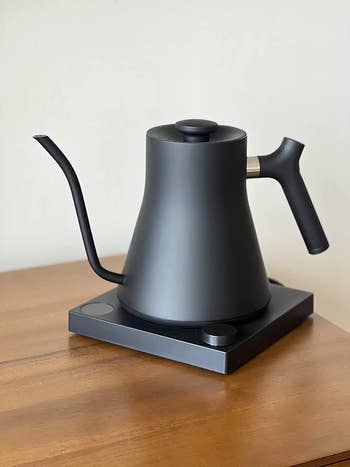 reviewer's black kettle on a table