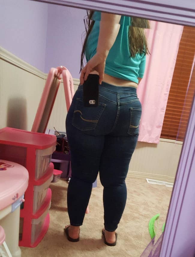 a reviewer photo of the back of the jeans showing the perfect fit