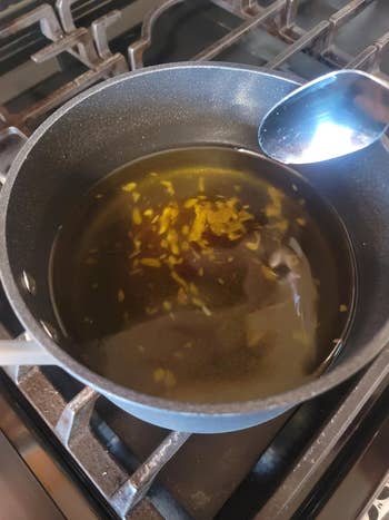 reviewer photograph  of the solidifier flakes successful  a cookware  of oil