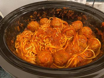 reviewers crock pot filled with spaghetti and meatballs