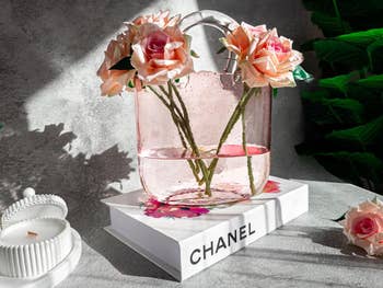 Transparent pink glittery purse vase 