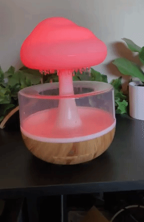 a gif of the raining cloud essential oil diffuser on and glowing red