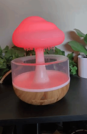 a gif of the raining cloud essential oil diffuser on and glowing red