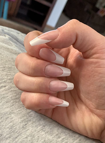 Reviewer with press on clear nails with white tips 