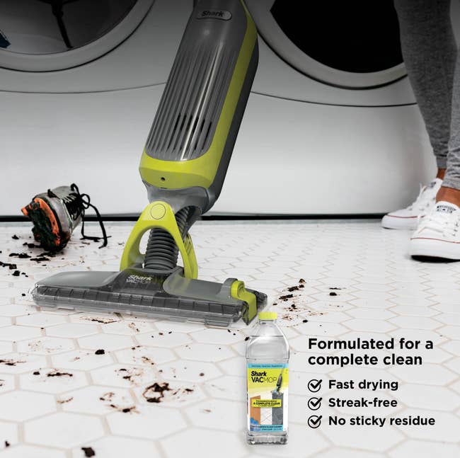 Vacuum cleaner being utilized connected a soiled floor; adjacent shoes suggest caller activity. Detergent vessel advertises accelerated drying, streak-free, nary residue
