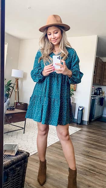 different reviewer wearing the dress in green polka dot