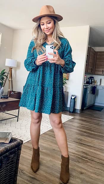 different reviewer wearing the dress in green polka dot