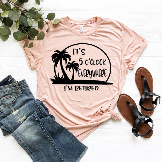 a peach colored t-shirt that says 