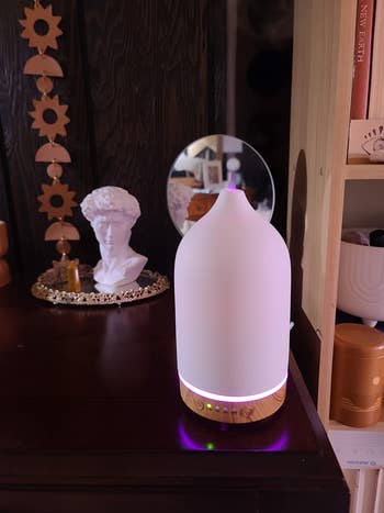 a reviewer's diffuser glowing pink