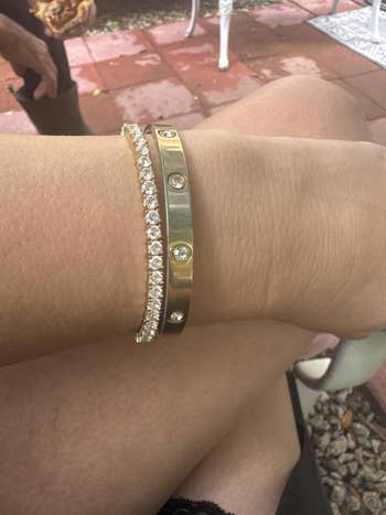  1  golden  with diamond accents, and 1  golden  with embedded diamonds, showcased successful  a relaxed outdoor setting