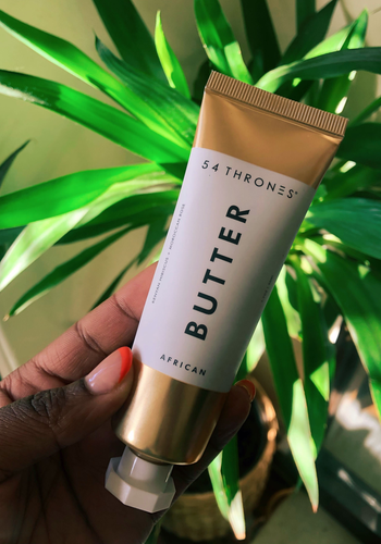 eco travel size toiletries Amanda holding up the tube of beauty butter