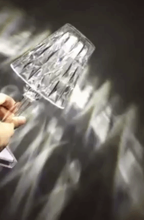 a gif from the seller showing how this lamp sparkles as light hits it