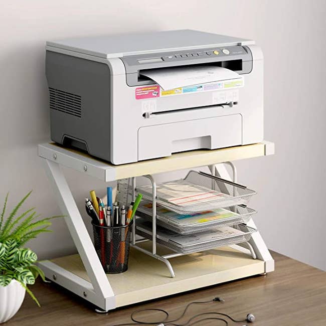 a printer sitting on a stand 