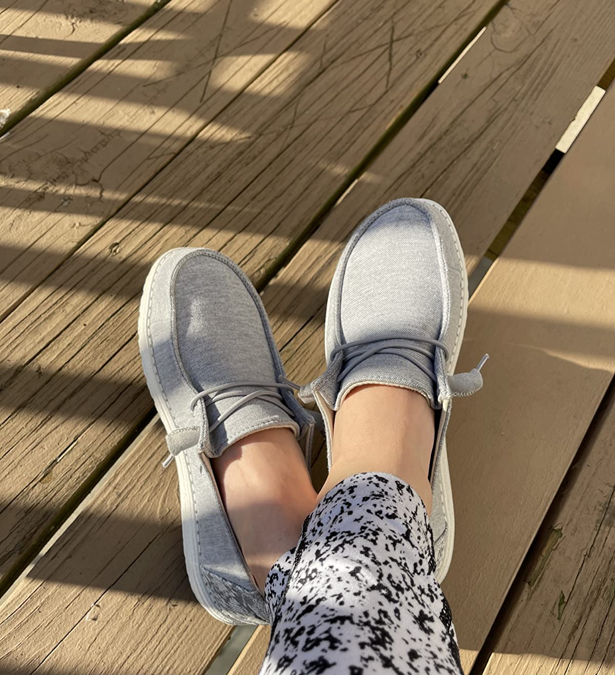 Reviewer is wearing the shoes in a light gray color