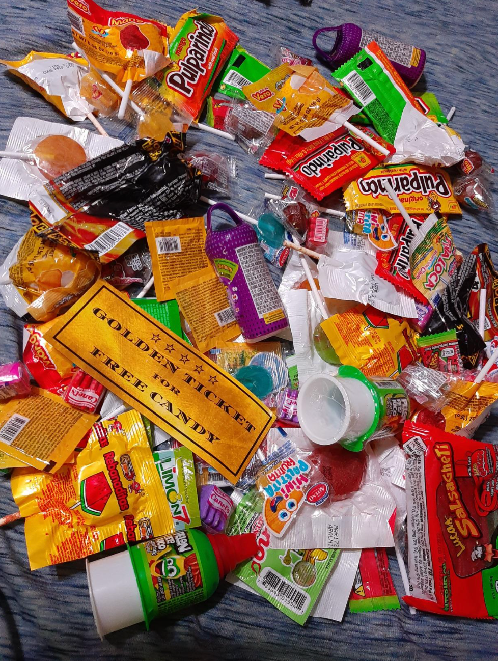 Reviewer image of candies spread out on a rug 