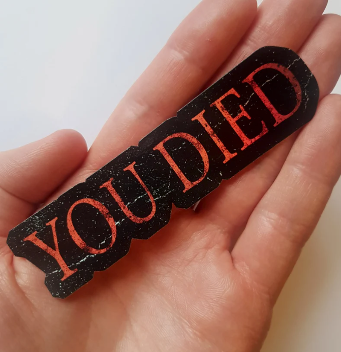 a black and red sticker that says