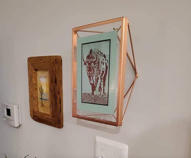 The frame in copper mounted on a wall