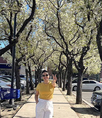 another reviewer wearing the white pants