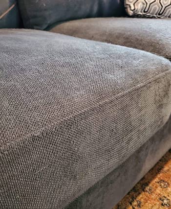 reviewer after image of the same cushion now smooth and free of matted fibers