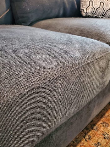 reviewer after image of the same cushion now smooth and free of matted fibers
