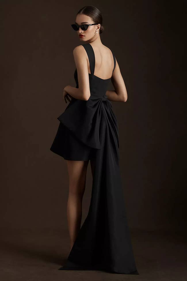 Short dress with floor length bow in back