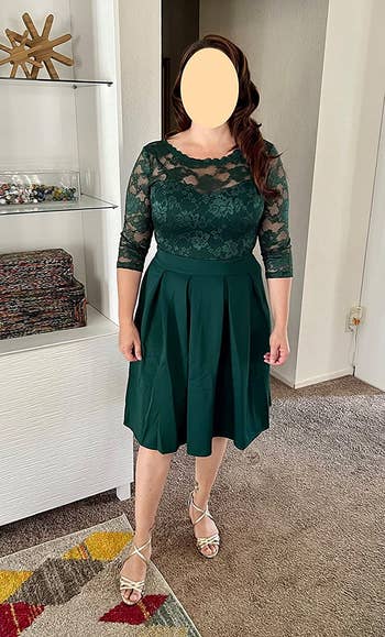 Reviewer wearing the same dress in an emerald green