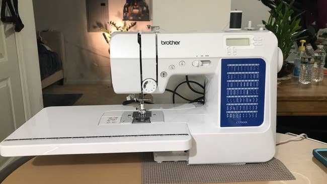 Brother sewing instrumentality with LCD screen, stitch options, and adjustable settings