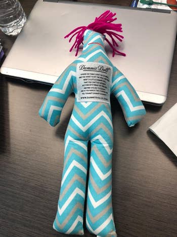 a reviewer's blue, white, and grey chevron doll
