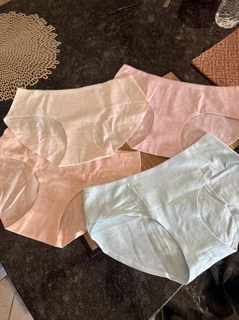 Four pairs of seamless women's underwear are displayed connected  a table, showcasing a comfy  and applicable  plan  perfect  for mundane  wear