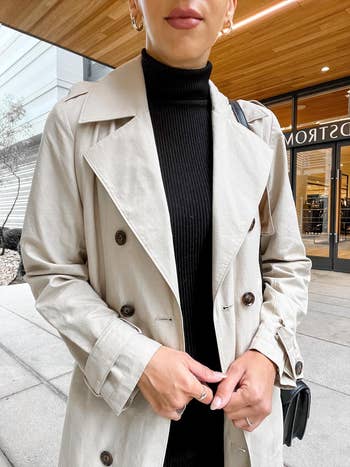 closeup look   astatine  reviewer's trench coat