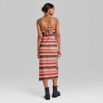 model in orange yellow and purple stripe version, showing off the strappy back