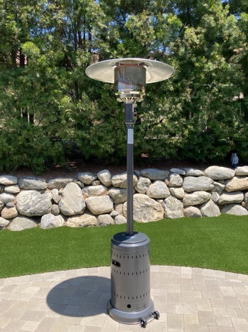 a reviewer's tall standing heater with a small shade-like top