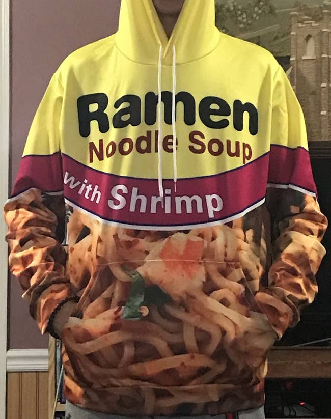 Reviewer wearing shrimp ramen noodle hoodie