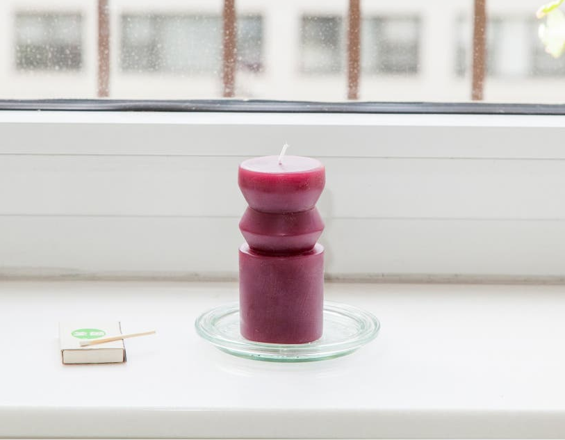 purple candle with sculptural shape