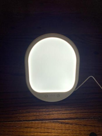 reviewer photo of the light therapy lamp